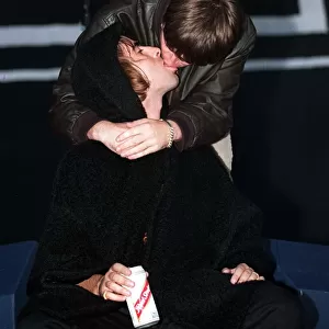 Gallagher brothers Noel and Liam kiss during Oasis concert Balloch park Loch Lomond