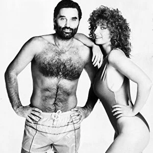 George Best footballer posing with woman model 1986