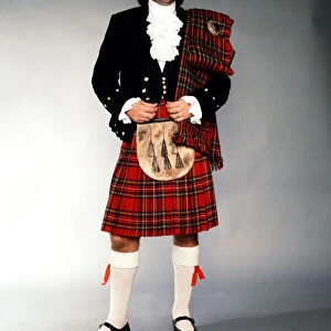 George Best wearing a kilt after signing for Hibernian. 24th November 1979