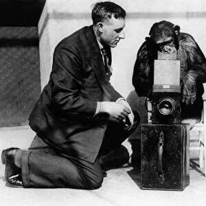 George Greenwell: 1927 George with a monkey using his camera - where he took some of his