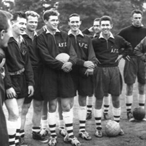 George Swindin, ex-Arsenal keeper and now Manager, talks to his team at a pre-season