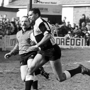 Gerald Cordle the Cardiff Winger goes through the Llanharen defence to score Cardiff