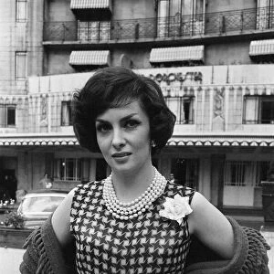 Gina Lollobrigida, Italian actress, poses for pictures outside the Dorchester Hotel