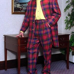 Glasgow Rangers footballer Paul Gascoigne dressed in a tartan suit. 14th June 1996