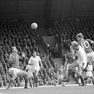 Gordon Wallace of Liverpool leaps high to win the ball with a header against the Arsenal