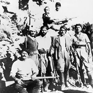 Greek guerialla fighters in the mountains of Crete wearing the traditional headdress