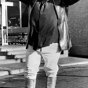 Greek singer Demis Roussos wearing platform boots before his concert at Newcastle City