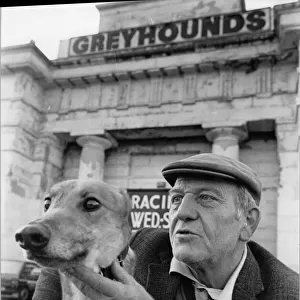 Greyhound trainer with his dog No Stranger at the last meeting at the Derby Greyhound