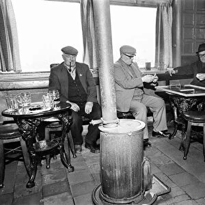 Group of men play dominoes at the Druids Head Inn in Coseley