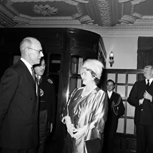 H. M. Queen Elizabeth the Queen Mother talking to Sir John Wolfenden (glasses)