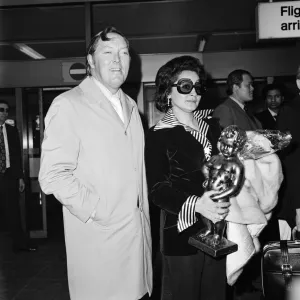 Bill Haley and his wife Martha arrive at Heathrow Airport. 15th May 1974