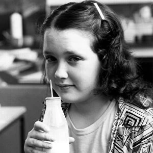 Hannah Chissick with a glass of milk. 2nd June 1987