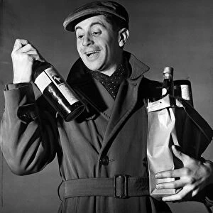 Hogmanay celebrations 1952 Our Scottish gent gets in supplies of Whisky for his new