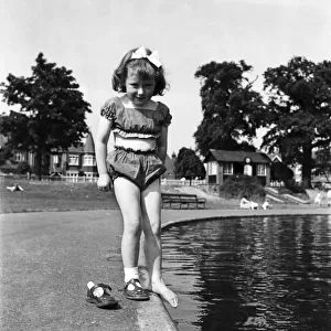 Holidays, little girl modelling swimsuit. June 1953 D3299-002