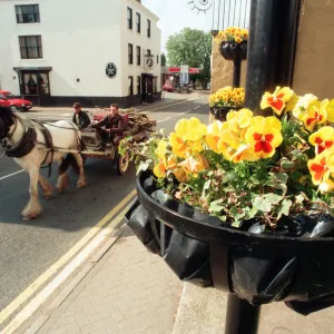 A horse and cart makes it way along Shipston-on-Stour High Street, Warwickshire