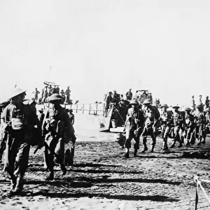 Indian troops disembarking from their landing craft after commandos had secured the beach