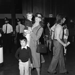 Italian actress Sophia Loren and her two children leaving Heathrow Airport for Rome