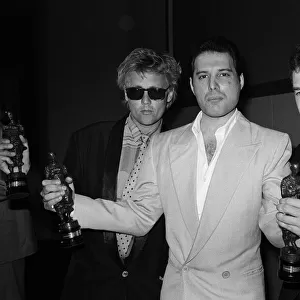 The Ivor Novello Awards. Pictured, Roger Taylor, Freddie Mercury and John Deacon of Queen