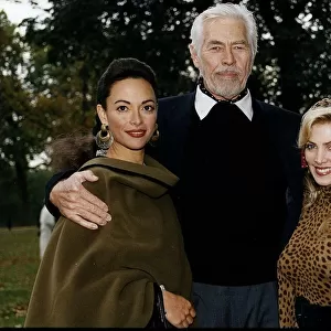 James Coburn American actor stands with his arms around Paula Murad on his left