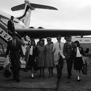 James Stewart arrives at London Airport with his wife Gloria