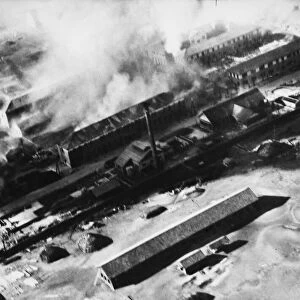 Japanese barracks on Tokushima airfield in Japan being bombed by the British Navy