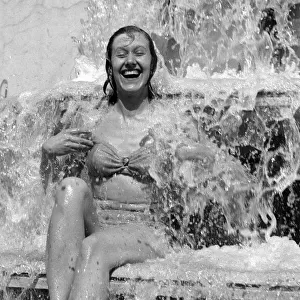 Jean Bentley, 21 year old, of Hammersmith found the right place under the fountain at