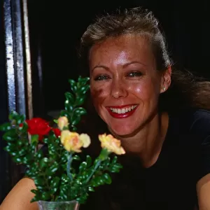 Jenny Agutter sitting at table March 1990