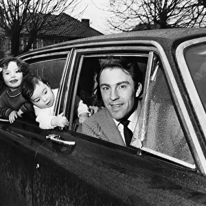 Jimmy Greaves very much alive takes his wife and two children out for a ride in his car