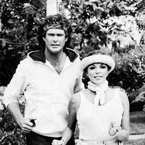 Joan Collins the actress with David Hasselhoff the actor jogging together. July 1984