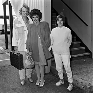 Joan Collins arrives at LAP from Los Angeles with her boyfriend Peter Holm