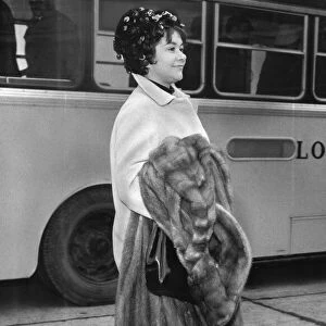 Joan Plowright carrying fur coat at Heathrow Airport - 24 / 02 / 1962