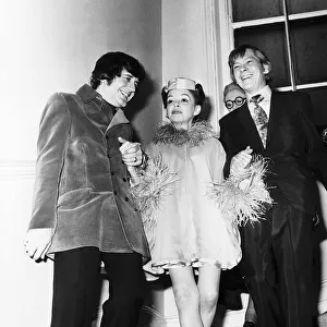 Judy Garland Actress and her new husband Mickey Deans walk down the stairs at Quaglinos