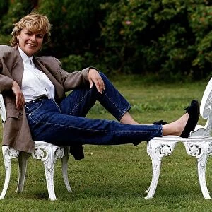 Julie Walters Actress and Commedienne Sitting on white garden chairs in garden