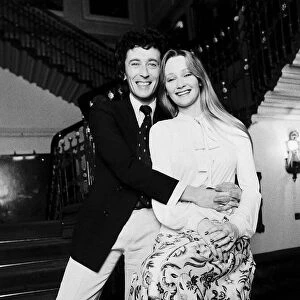 Karen Dotrice Actress and Robert Powell Actor sitting on bannister rail at the bottom of