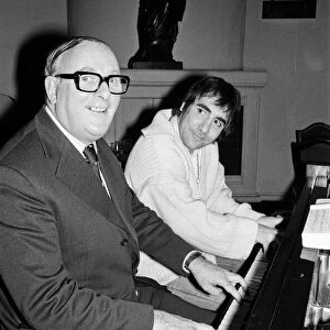 Keith Moon, drummer with British rock group The Who, pictured at the piano with