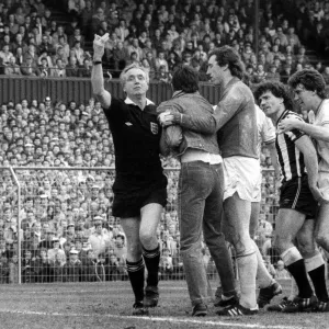 Kevin Keegan argues with a fan that has run on the pitch at St James Park 15 April 1984