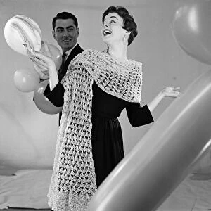 Knitted stole modelled by Jackie Jackson with Michael Bentley in background. July 1955