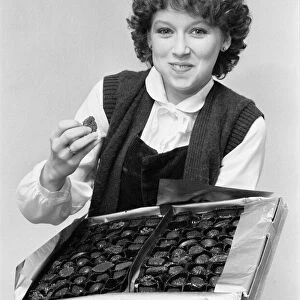 Lena Zavaroni, aged 16, eating from box of chocolates, January 1980