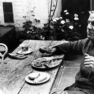 Leo Abse, MP for Pontypool, having breakfast in the garden of his home in London