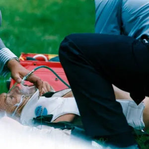 Lester Piggott receives treatment after falling from Coffe n Cream at Goodwood racecourse