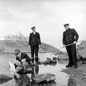 The lighthouse keepers and their families go about their daily duties around The Strathy