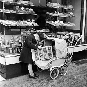 Little boy waits for his mother outside the Bakers shop in Stratford-upon-Avon