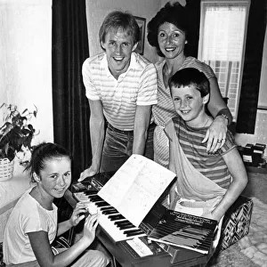 Liverpool footballer Phil Neal with wife Sue and their children at home