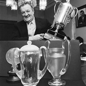 Former Liverpool manager Bob Paisley with a few replicas of the trophies which he won