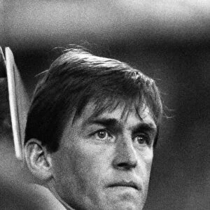 Liverpool manager Kenny Dalglish watches the game from the bench shortly before his