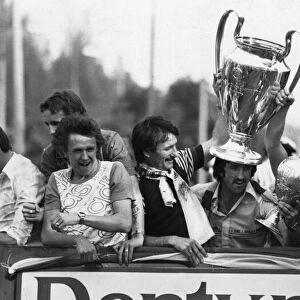 Liverpool show off the League Championship and European Cup trophies to their fans