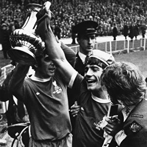 Liverpool players Kevin and Keegan celebrate with the FA Cup trophy following their 3-0