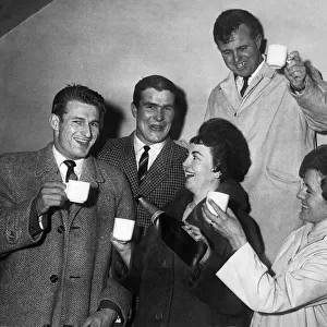 Liverpool players Roger Hunt and Ron Yeats are toasted with champagne after Liverpool won