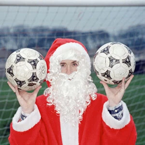 Liverpool striker Robbie Fowler dressed as Farther Christmas. 19th December 1995