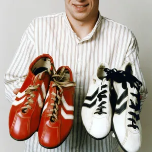 Liverpool teenage sensation Robbie Fowler with 2 pairs of football boots